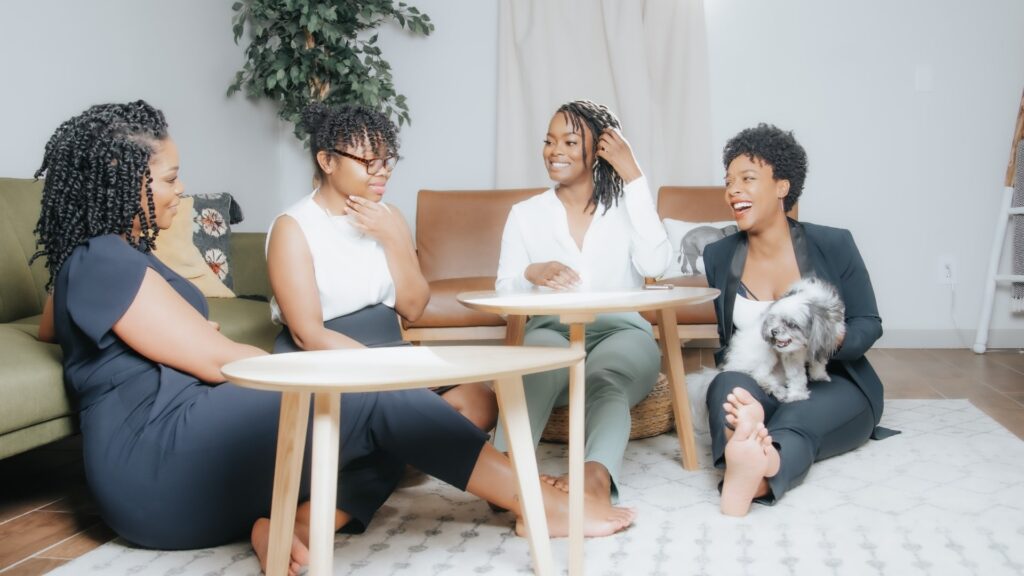 Professional Organizer Atlanta, GA four black women sitting at a round table smiling