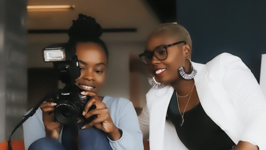 Professional Organizer Atlanta, GA two black women looking at images in a camera